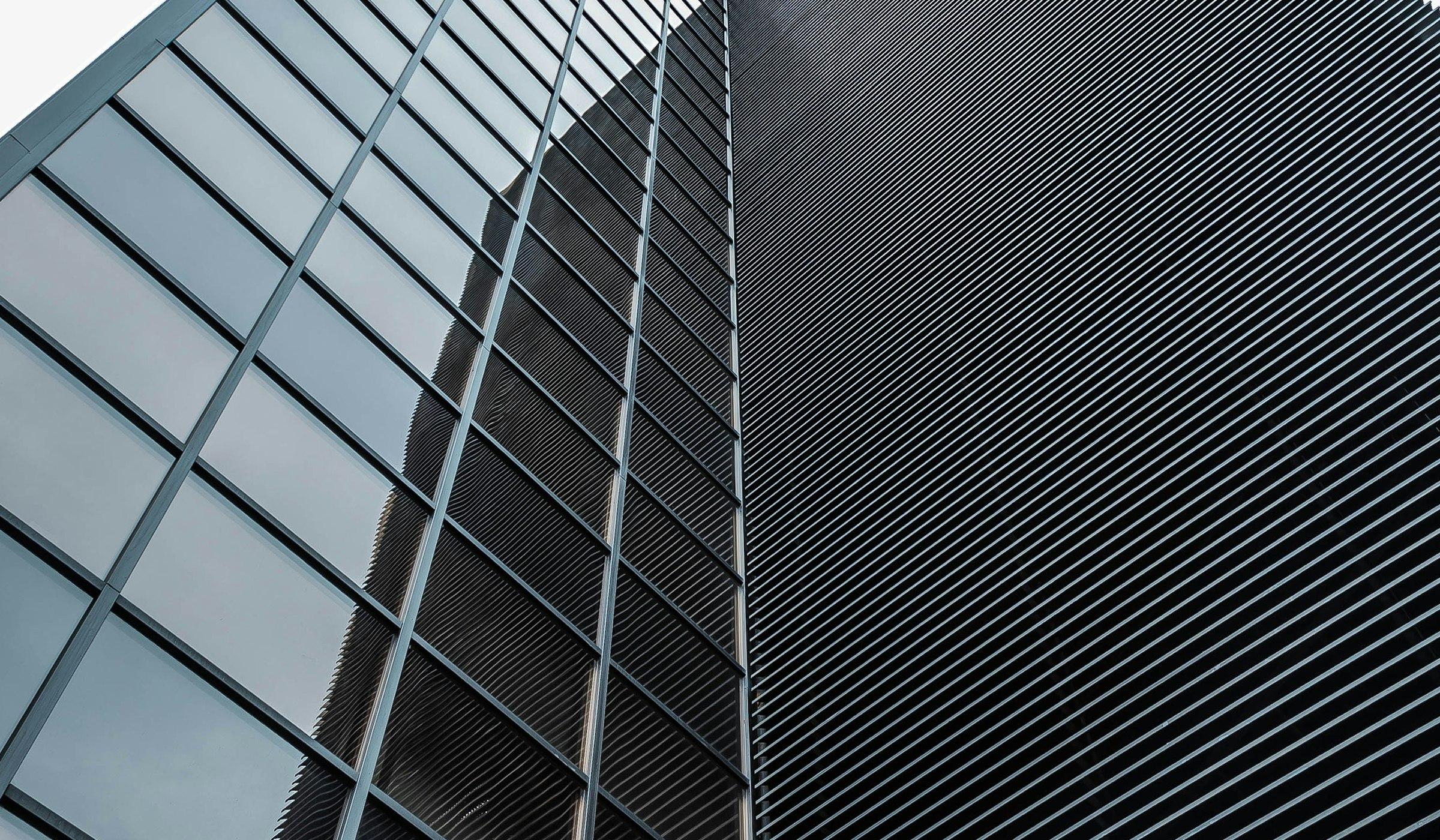 Low-angle view of a dark glass building — modern architecture