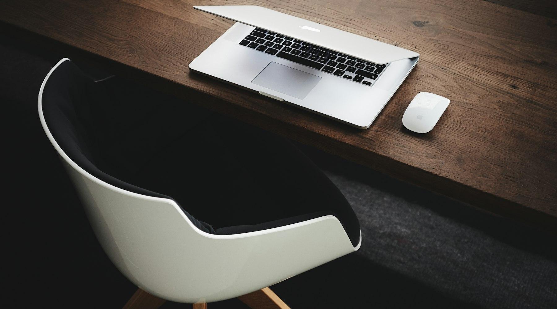 Clean minimal desk with laptop — modern professional workspace