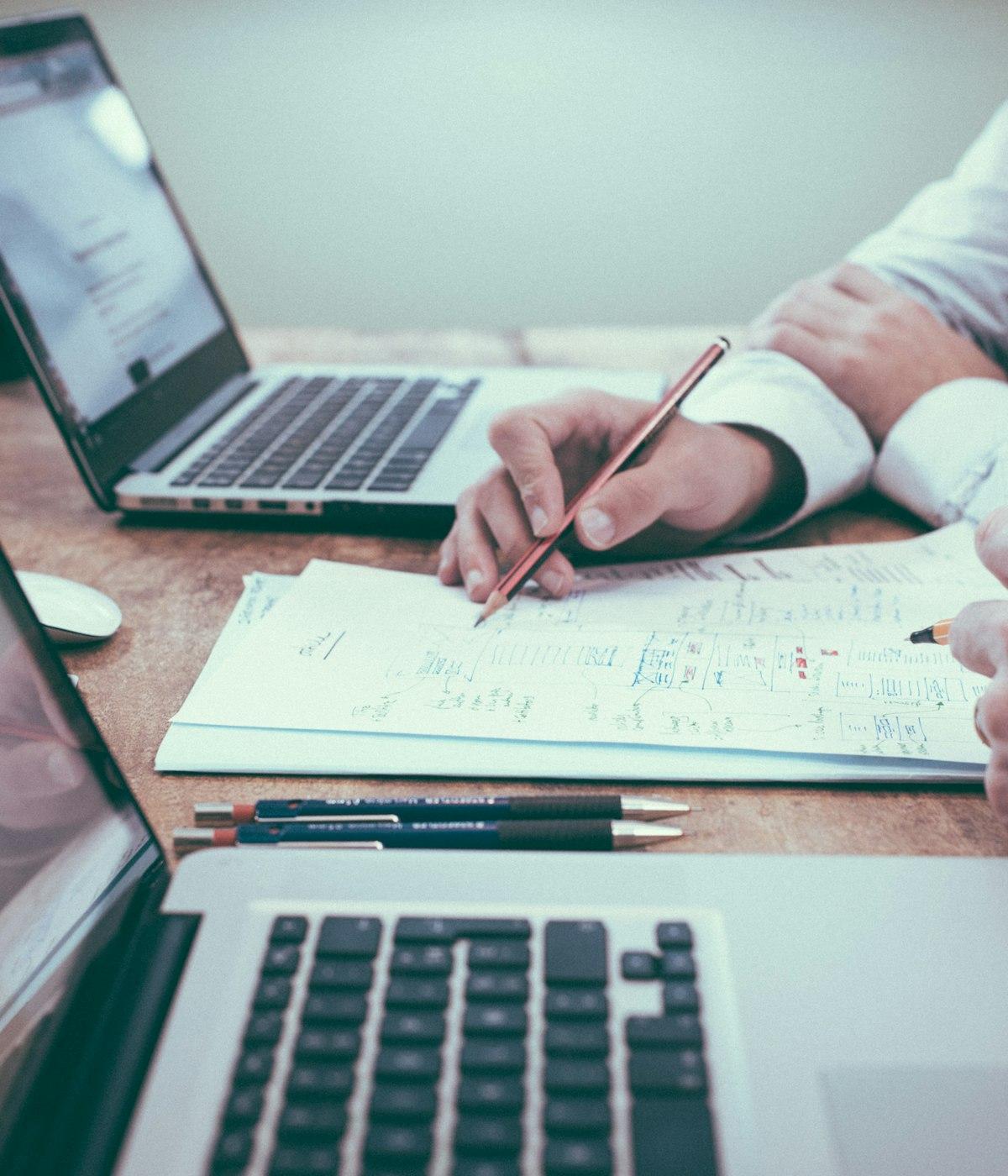 Notebook and documents on a desk — considered work